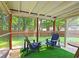 Enclosed patio with an outdoor ceiling and two chairs at 2405 Ingram Rd, Duluth, GA 30096
