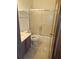 Clean bathroom featuring a tub and shower with sliding glass doors and wood cabinets at 2752 Inverloch Cir, Duluth, GA 30096