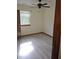 Bright bedroom with ceiling fan and hardwood floors at 2752 Inverloch Cir, Duluth, GA 30096