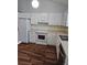 Kitchen featuring white cabinets, laminate countertops, and essential appliances at 2752 Inverloch Cir, Duluth, GA 30096