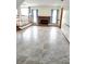 Bright living room featuring decorative tile flooring, fireplace, and large windows at 2752 Inverloch Cir, Duluth, GA 30096
