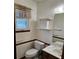 Cozy powder room with a toilet, vanity, sink, and window with natural light at 2752 Inverloch Cir, Duluth, GA 30096