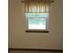 Window view overlooking water, framed by simple curtain, offering peaceful scenery at 2752 Inverloch Cir, Duluth, GA 30096