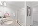Updated bathroom features double sinks with granite counters and a glass-enclosed shower at 6009 Pine Bluff Pl, Conyers, GA 30013