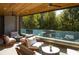 Relaxing covered balcony with comfortable lounge furniture, offering a private outdoor space with serene views of lush greenery at 675 Drewry Ne St # 205, Atlanta, GA 30306