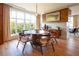 Elegant dining room with a large window, stylish table, and hardwood floors, creating an ideal space for gatherings at 675 Drewry Ne St # 205, Atlanta, GA 30306