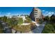 Contemporary condo building with walking trail access surrounded by trees and blue sky background, offering modern living at 675 Drewry Ne St # 205, Atlanta, GA 30306