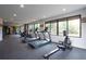 A modern gym offers treadmills and exercise equipment with windows providing exterior views at 675 Drewry Ne St # 205, Atlanta, GA 30306