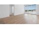 Living area with hardwood floors, white walls, and exterior views through the large sliding glass doors at 675 Drewry Ne St # 205, Atlanta, GA 30306