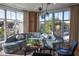 Bright living room filled with natural light from large windows, complete with stylish decor and comfortable seating at 675 Drewry Ne St # 205, Atlanta, GA 30306