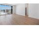 Living space features hardwood floors, white walls, and a view to an exterior balcony through sliding glass doors at 675 Drewry Ne St # 205, Atlanta, GA 30306