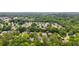An aerial view of the community showcases tree-lined streets in a quiet neighborhood at 225 Carriage Station Cir, Roswell, GA 30075
