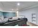 Finished basement with blue accent wall and white shiplap wall at 225 Carriage Station Cir, Roswell, GA 30075