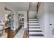 Charming foyer with hardwood floors, staircase and entry to Living Room at 225 Carriage Station Cir, Roswell, GA 30075
