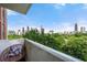 Balcony view of city skyline and lush green trees at 375 Ralph Mcgill Ne Blvd # 707, Atlanta, GA 30312