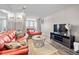 Bright living room with modern furniture and view of city skyline from balcony at 375 Ralph Mcgill Ne Blvd # 707, Atlanta, GA 30312