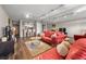 Well-lit living room with hardwood floors, open kitchen view, and mirrored wall at 375 Ralph Mcgill Ne Blvd # 707, Atlanta, GA 30312