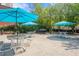 Outdoor picnic area with multiple tables and seating, trees, and a barbecue grill at 375 Ralph Mcgill Ne Blvd # 707, Atlanta, GA 30312