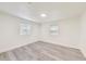 Bedroom with light gray wood-look flooring and two bright windows at 500 Pomoma Circle Sw, Atlanta, GA 30315