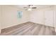 Bright bedroom with new floors, fresh white paint, ceiling fan, and two closets at 500 Pomoma Circle Sw, Atlanta, GA 30315