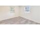 Well lit bedroom with two windows and light gray wood-look flooring at 500 Pomoma Circle Sw, Atlanta, GA 30315