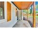Close up of a charming home featuring a covered porch, wooden shutters, and the house number at 500 Pomoma Circle Sw, Atlanta, GA 30315