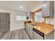 Modern kitchen with stainless steel appliances, freshly painted gray cabinets, and wood countertops at 500 Pomoma Circle Sw, Atlanta, GA 30315