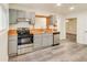 Bright kitchen featuring stainless steel appliances, gray cabinets, and refinished wood countertops at 500 Pomoma Circle Sw, Atlanta, GA 30315