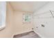 Clean laundry room features new floors, fresh white paint, window, and connections for appliances at 500 Pomoma Circle Sw, Atlanta, GA 30315
