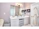 Bathroom vanity features dual sinks and lots of storage at 5765 Woodstone Dr, Cumming, GA 30028