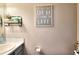 Powder room with neutral tones and decorative accents at 5765 Woodstone Dr, Cumming, GA 30028