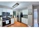 Bright kitchen features stainless steel appliances, tile backsplash, and granite countertops at 5765 Woodstone Dr, Cumming, GA 30028