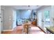 Open floor plan of kitchen and living room, with a large couch and natural light at 5765 Woodstone Dr, Cumming, GA 30028