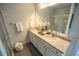 Well-lit bathroom offers double sinks with granite countertops and a glass-enclosed shower at 6011 Pine Bluff Pl, Conyers, GA 30013