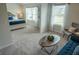 This home features an ensuite sitting room off the main bedroom with large windows at 6011 Pine Bluff Pl, Conyers, GA 30013