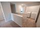 Bright upstairs laundry room features modern appliances and convenient access from the hallway at 6011 Pine Bluff Pl, Conyers, GA 30013