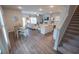 Bright and airy open-concept featuring a dining area, kitchen island, living room, and staircase at 6011 Pine Bluff Pl, Conyers, GA 30013