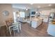 Spacious open-concept showcases living room, dining area, and modern kitchen with a large kitchen island and stainless appliances at 6011 Pine Bluff Pl, Conyers, GA 30013