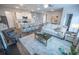 Inviting open-concept living space with a cozy living room, dining area, and a modern kitchen with a spacious island at 6011 Pine Bluff Pl, Conyers, GA 30013