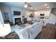 Cozy open-concept layout features a fireplace, hardwood floors, a modern kitchen, and plenty of natural light at 6011 Pine Bluff Pl, Conyers, GA 30013