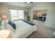 Spacious main bedroom boasts ample natural light and a calming color palette and a peek at the sitting room at 6011 Pine Bluff Pl, Conyers, GA 30013
