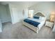 This spacious main bedroom features neutral décor, a ceiling fan, and large windows at 6011 Pine Bluff Pl, Conyers, GA 30013