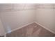 The walk-in closet features neutral carpeting and wire shelving at 6011 Pine Bluff Pl, Conyers, GA 30013