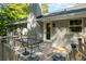 Outdoor deck with furniture, ideal for entertaining or enjoying quiet moments overlooking the backyard at 6133 Post Rd, Douglasville, GA 30135