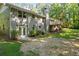 Expansive backyard featuring a deck, patio, and brick exterior, providing ample space for outdoor enjoyment at 6133 Post Rd, Douglasville, GA 30135