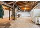 Unfinished basement with exposed beams, concrete floor and potential for customization at 6133 Post Rd, Douglasville, GA 30135