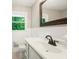 Bathroom with white vanity and a window with a wooded view at 6133 Post Rd, Douglasville, GA 30135