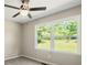 Bedroom featuring a ceiling fan, and a window with a backyard view at 6133 Post Rd, Douglasville, GA 30135