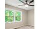 Bedroom featuring a ceiling fan, and a window with a lush green view at 6133 Post Rd, Douglasville, GA 30135