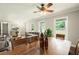 Open-concept living and dining room with updated flooring, neutral paint, and lots of natural light at 6133 Post Rd, Douglasville, GA 30135
